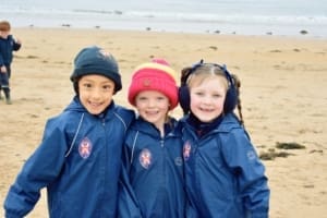 Three St Leonards pupils enjoying a trip to the beach which is only a short walk from the campus